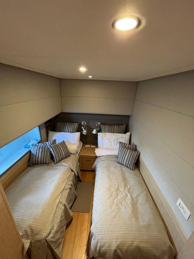a room with two beds aboard NEVER TOO LATE Yacht for Sale