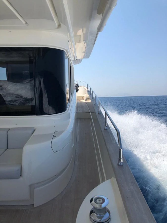 a boat on the water aboard NEVER TOO LATE Yacht for Sale