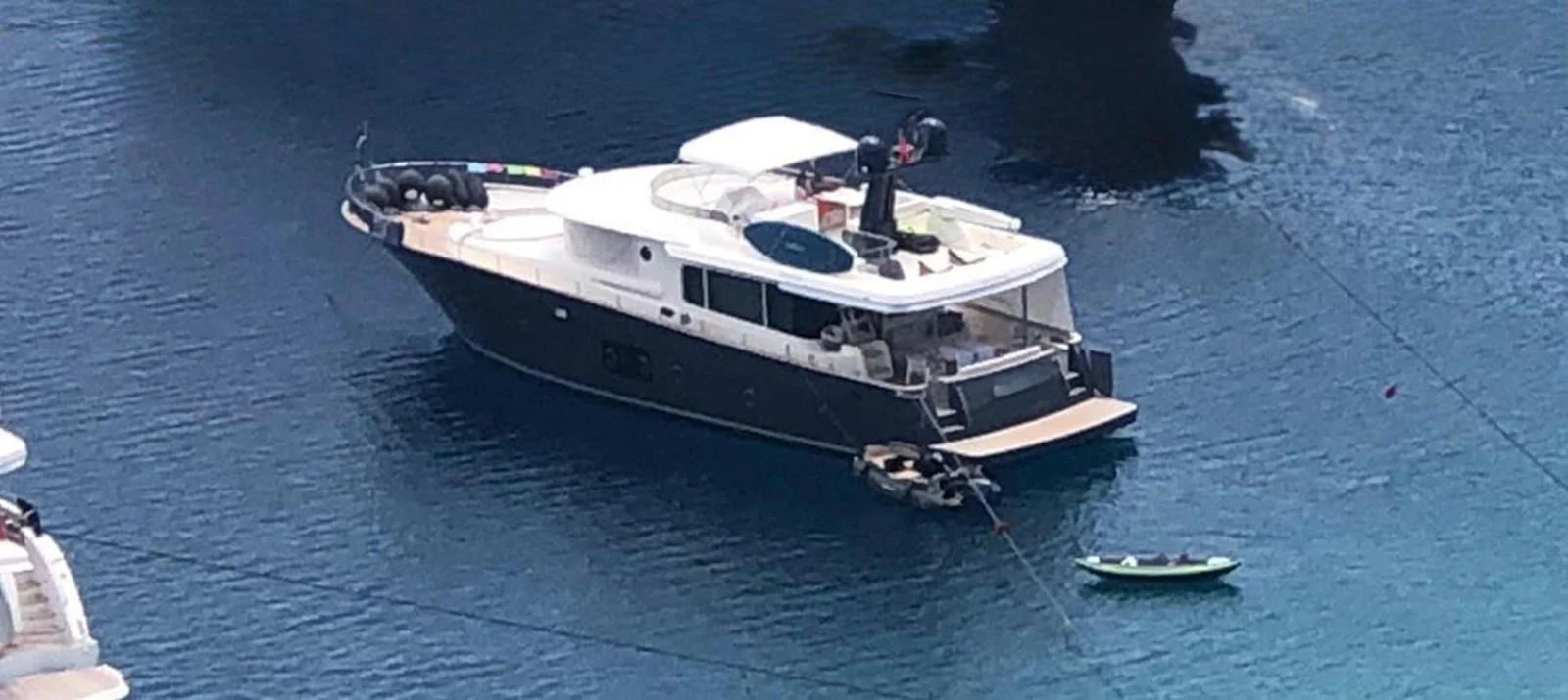 a boat on the water aboard NEVER TOO LATE Yacht for Sale
