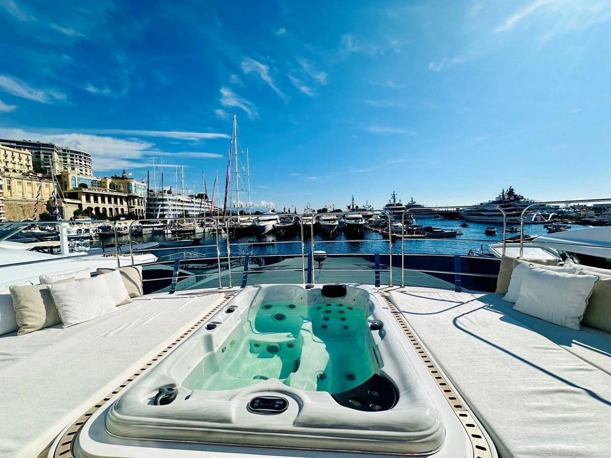 The sundeck features a luxurious jacuzzi with a stunning marina view. aboard OPTIMISM Yacht for Sale