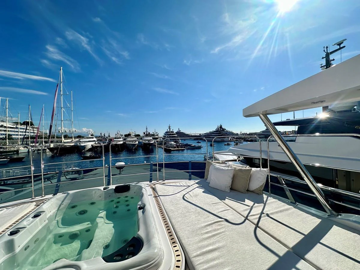The sundeck features a luxurious jacuzzi and comfortable sun loungers, perfect for relaxation under the sun. aboard OPTIMISM Yacht for Sale