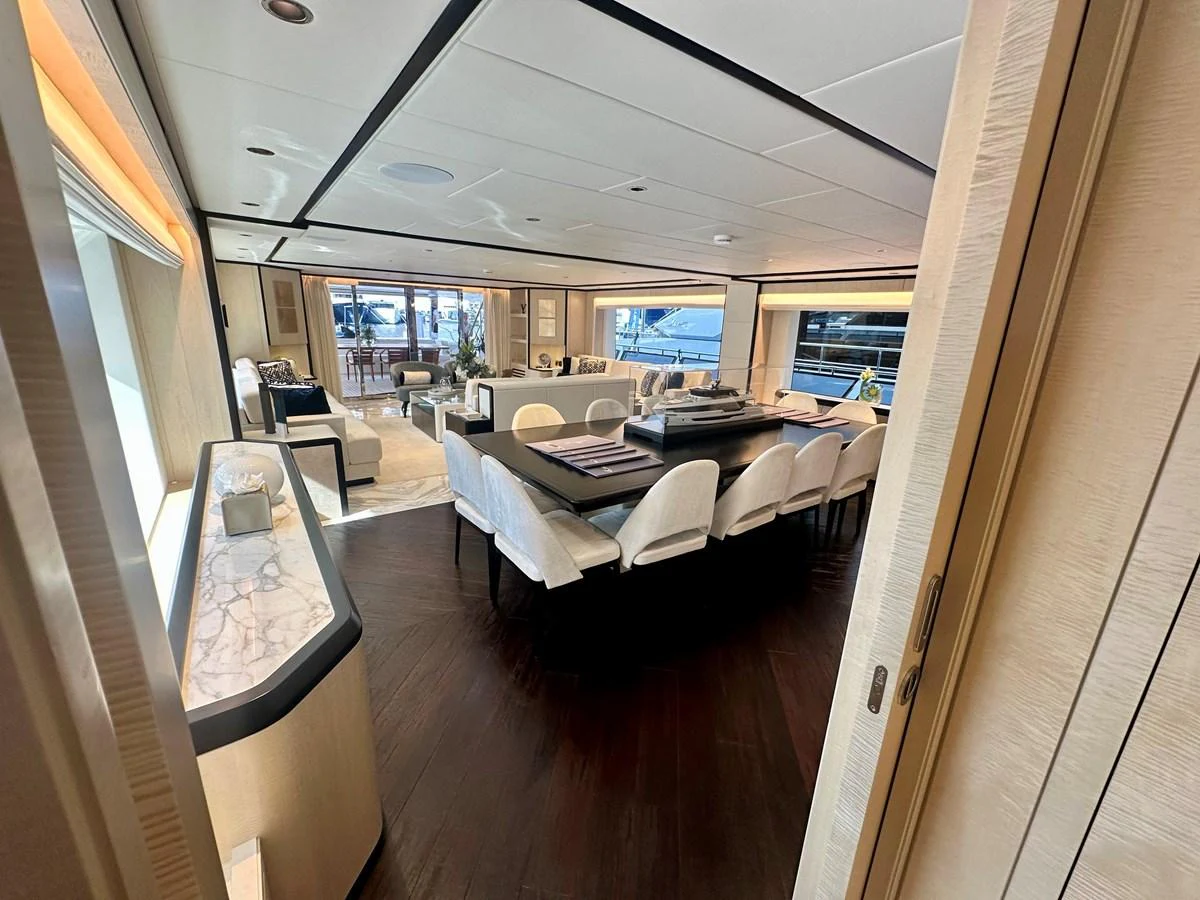 a room with a couch and a table aboard OPTIMISM Yacht for Sale