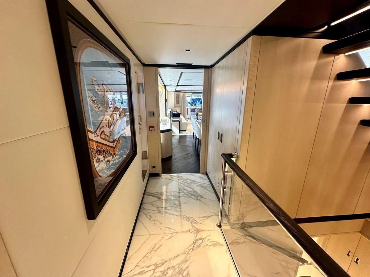 A luxurious hallway with marble flooring and elegant decor. aboard OPTIMISM Yacht for Sale