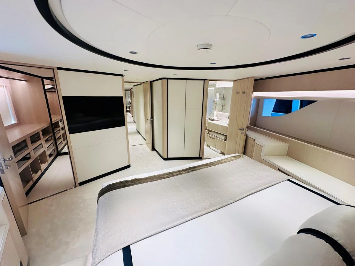 The master stateroom features elegant design with ample storage and luxurious bedding. aboard OPTIMISM Yacht for Sale