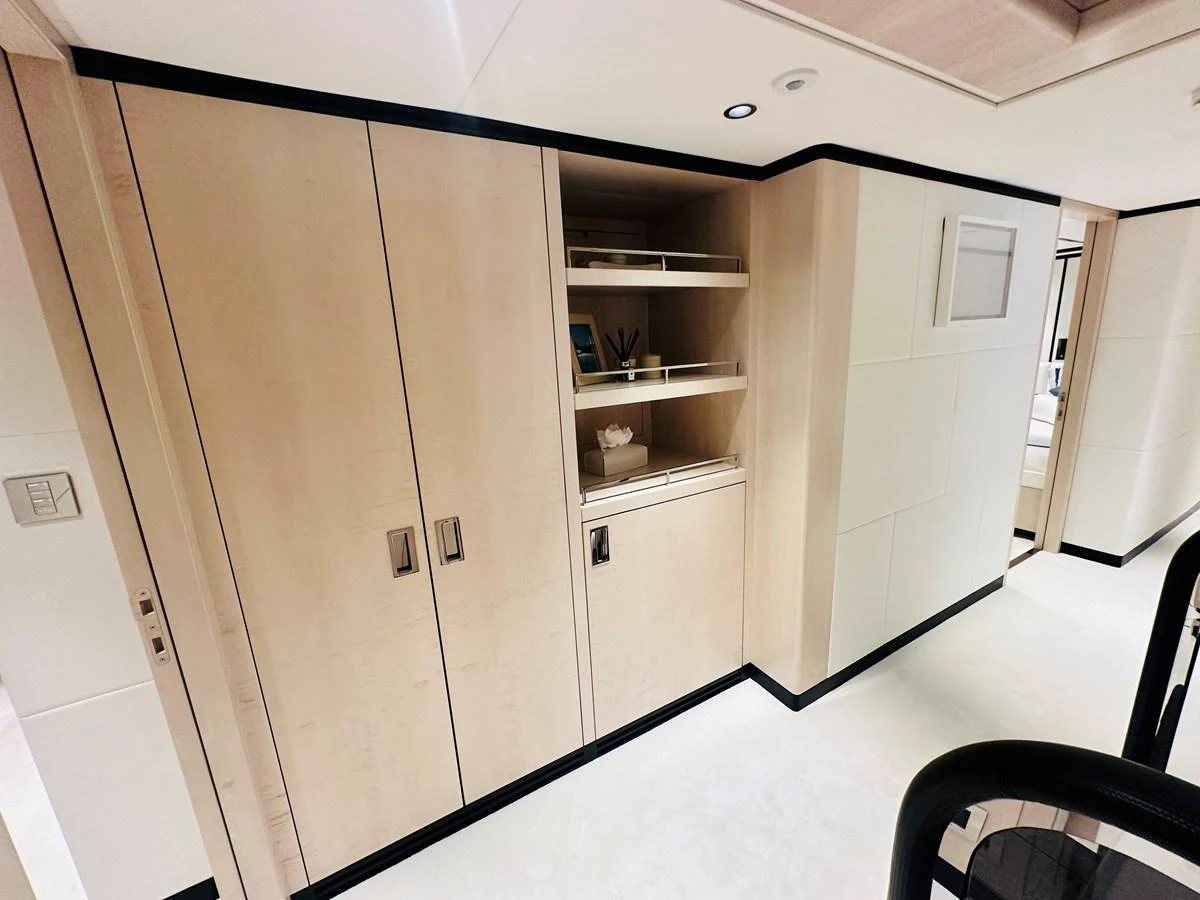 a room with a cabinet and shelves aboard OPTIMISM Yacht for Sale