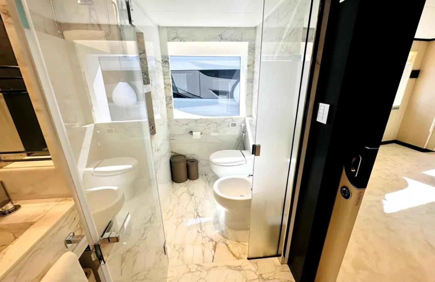 The yacht's bathroom features luxurious marble surfaces and modern fixtures. aboard OPTIMISM Yacht for Sale