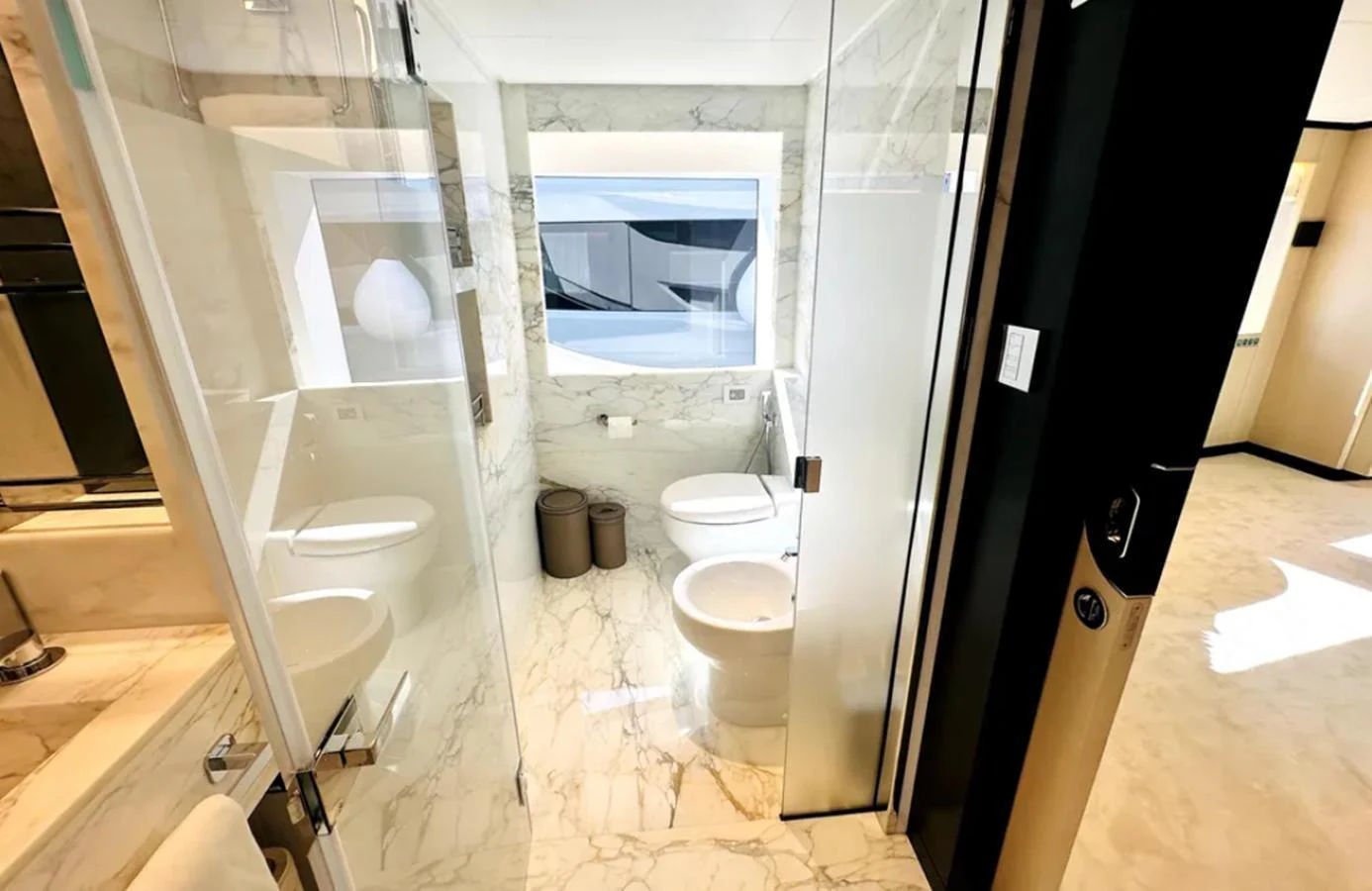 A luxurious bathroom with marble surfaces and modern fixtures. aboard OPTIMISM Yacht for Sale