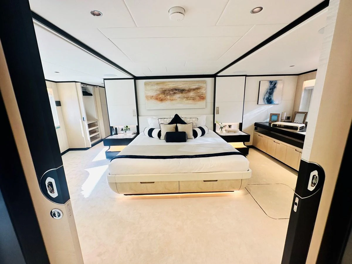 a bedroom with a bed aboard OPTIMISM Yacht for Sale