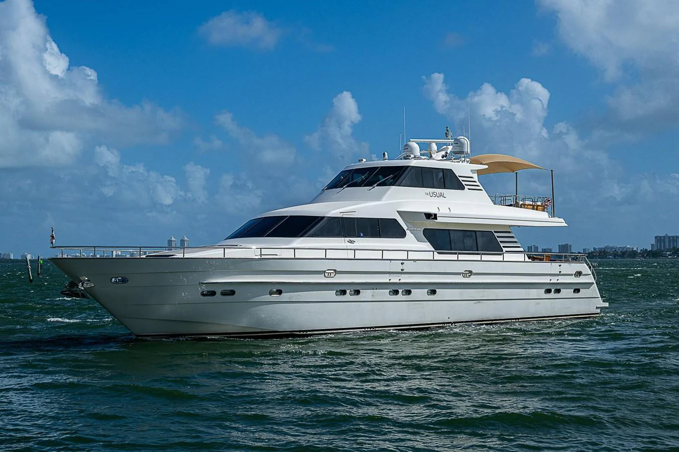a white yacht in the water aboard THE USUAL Yacht for Sale