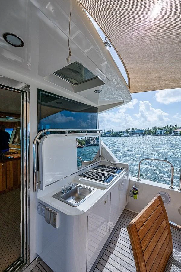 a boat with a sink and a window aboard THE USUAL Yacht for Sale