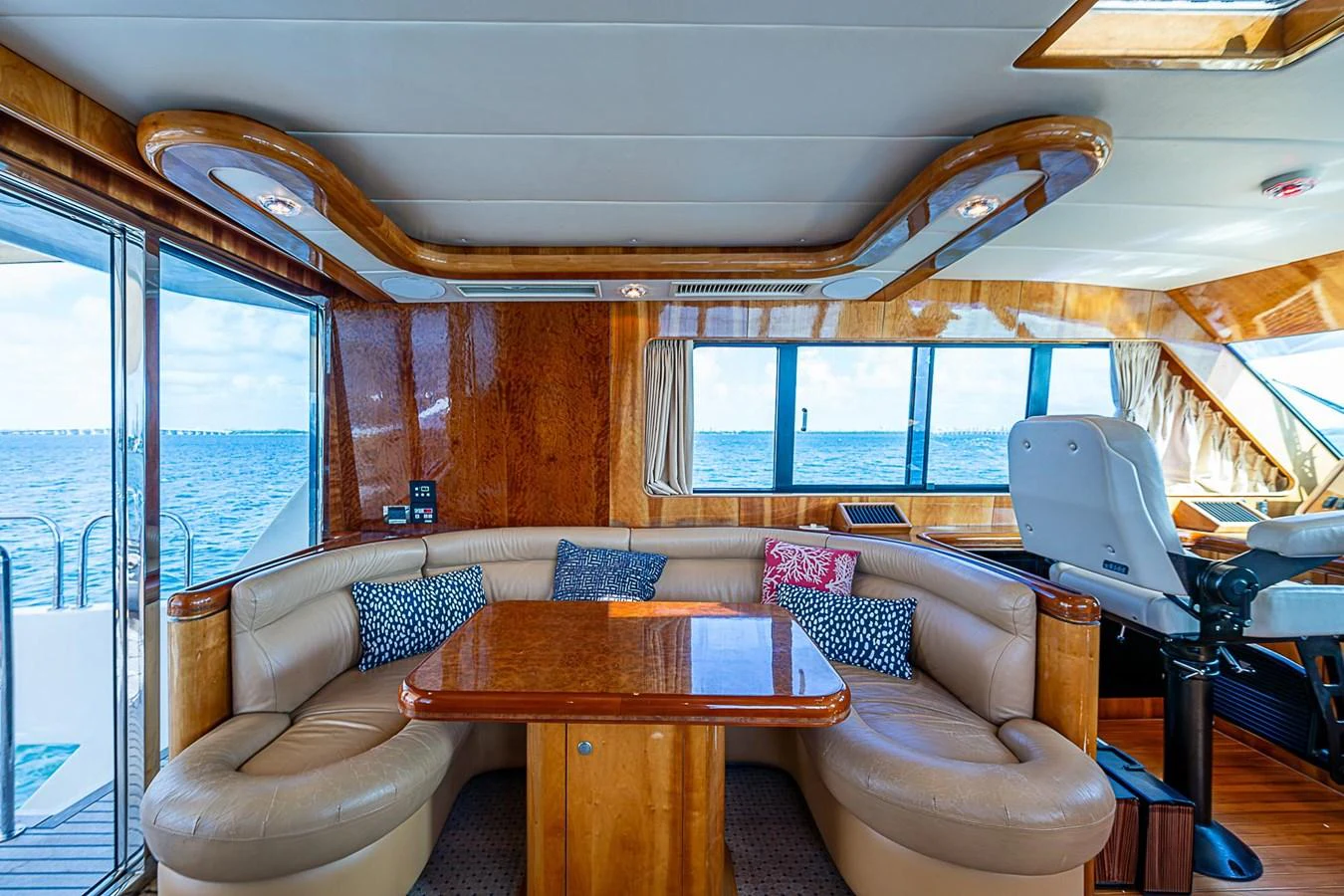 a living room with a table and chairs aboard THE USUAL Yacht for Sale