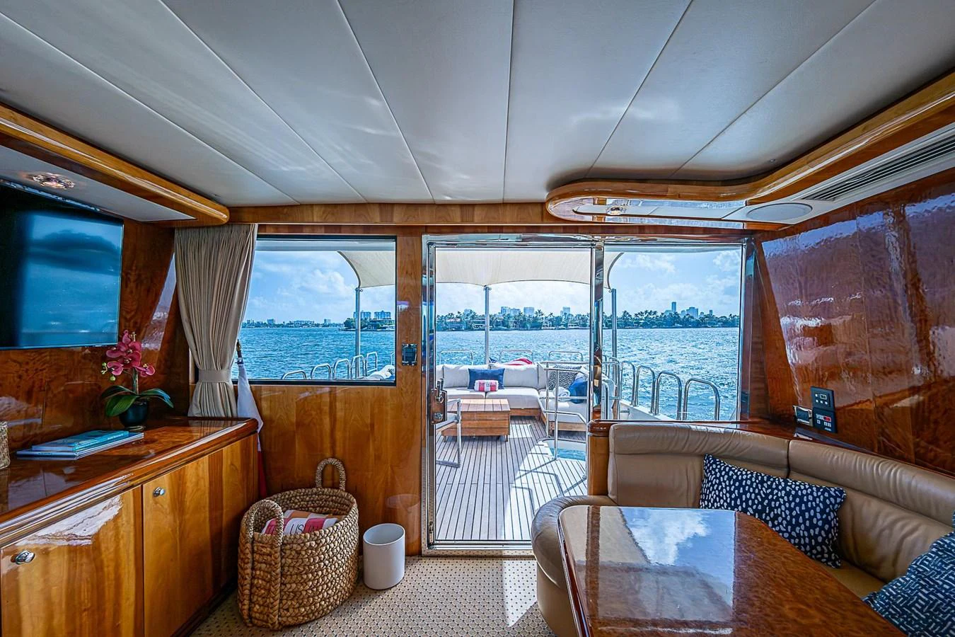 a living room with a large window aboard THE USUAL Yacht for Sale