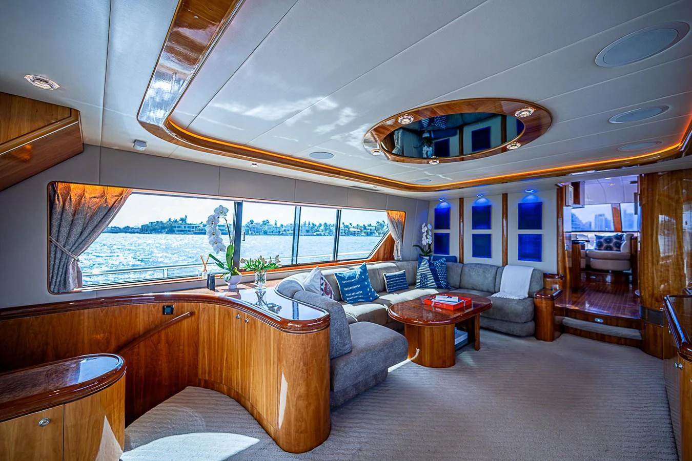 a living room with a large window aboard THE USUAL Yacht for Sale