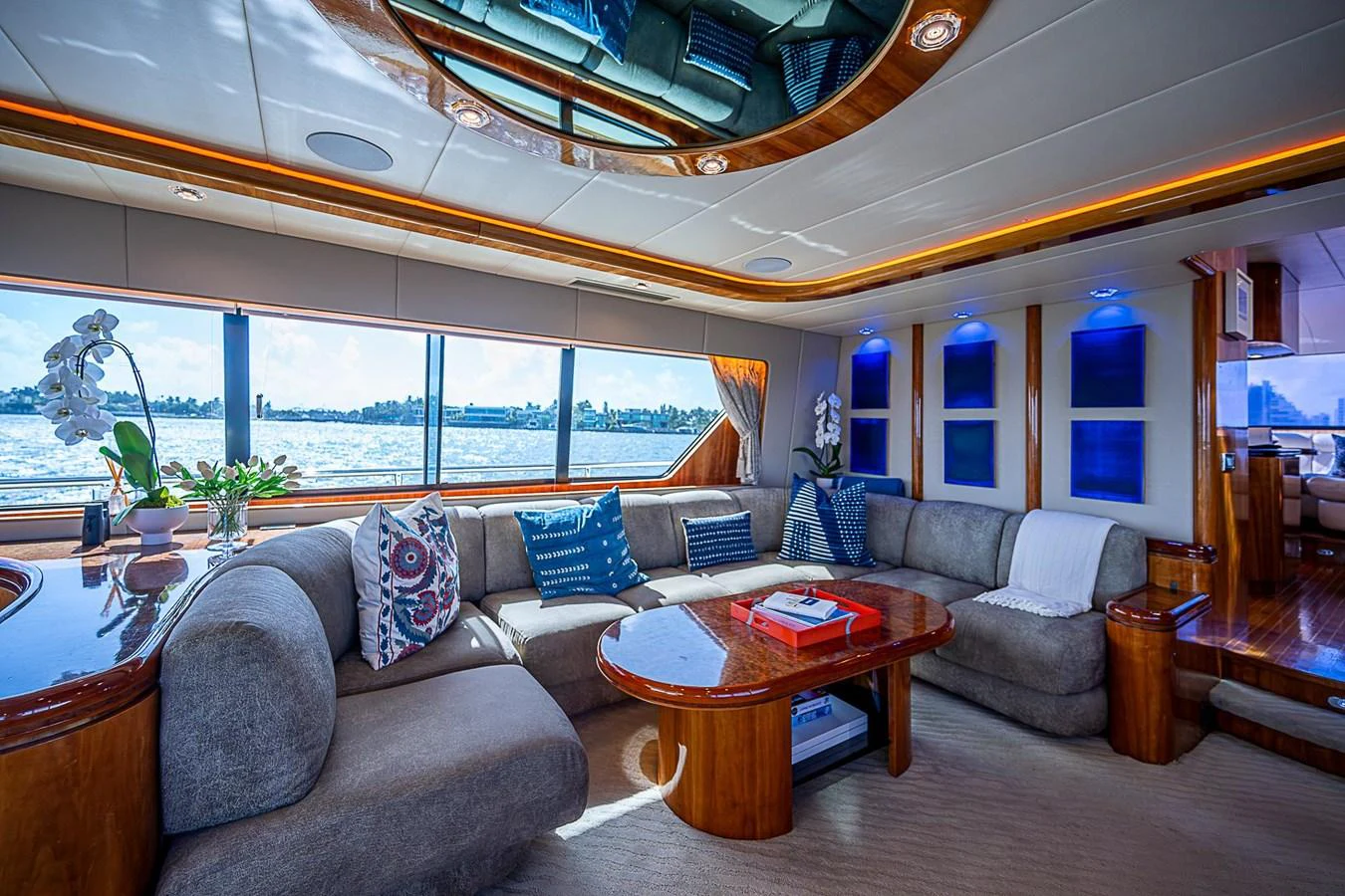 a living room with a large window aboard THE USUAL Yacht for Sale