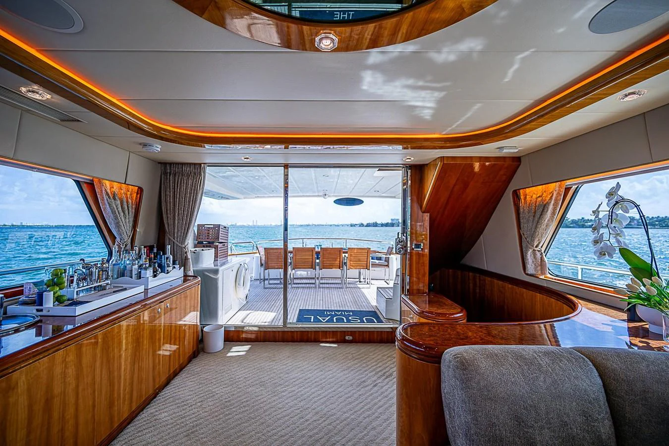 a room with a view of the ocean and the deck aboard THE USUAL Yacht for Sale