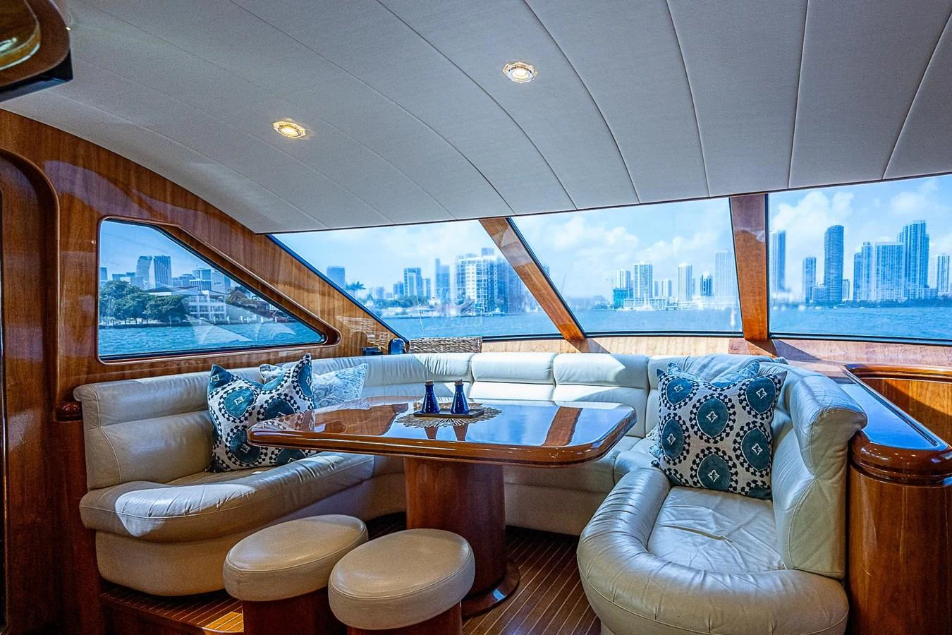 a room with a table and chairs aboard THE USUAL Yacht for Sale