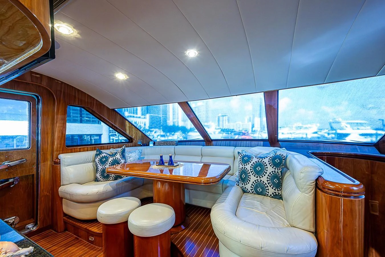 a room with a table and chairs aboard THE USUAL Yacht for Sale