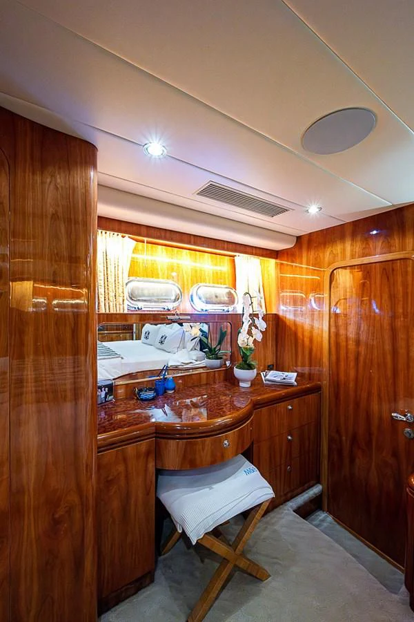 a kitchen with a table and chairs aboard THE USUAL Yacht for Sale