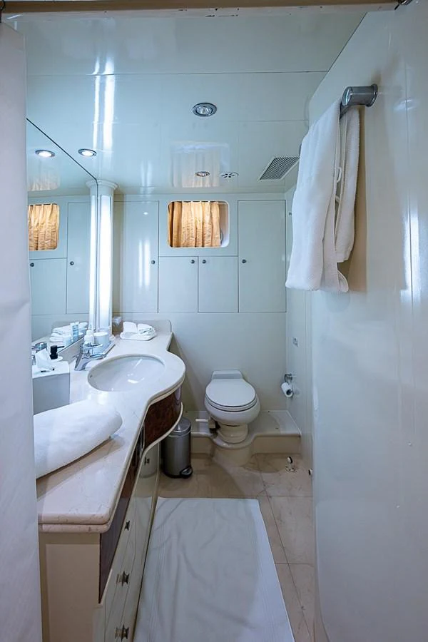a bathroom with a sink toilet and a bathtub aboard THE USUAL Yacht for Sale