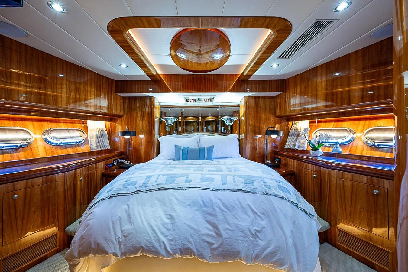 a bedroom with wood walls aboard THE USUAL Yacht for Sale