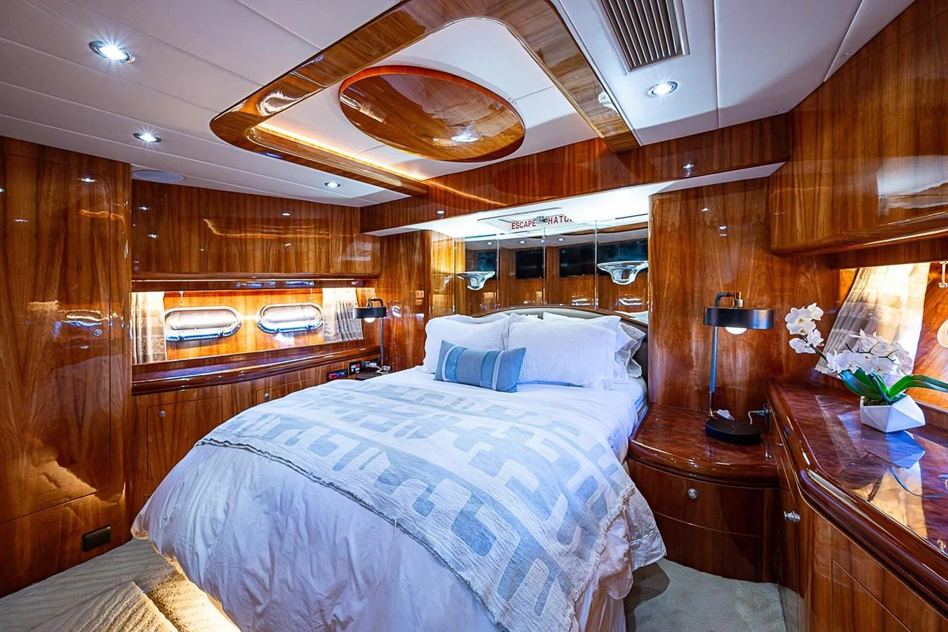 a room with a bed and a table aboard THE USUAL Yacht for Sale