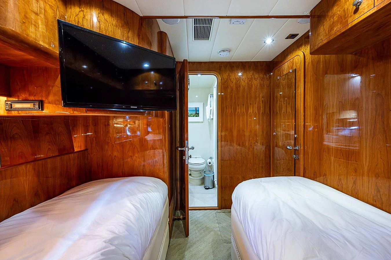 a room with wooden furniture aboard THE USUAL Yacht for Sale