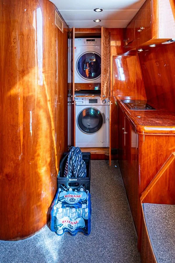 a laundry room with a washing machine aboard THE USUAL Yacht for Sale