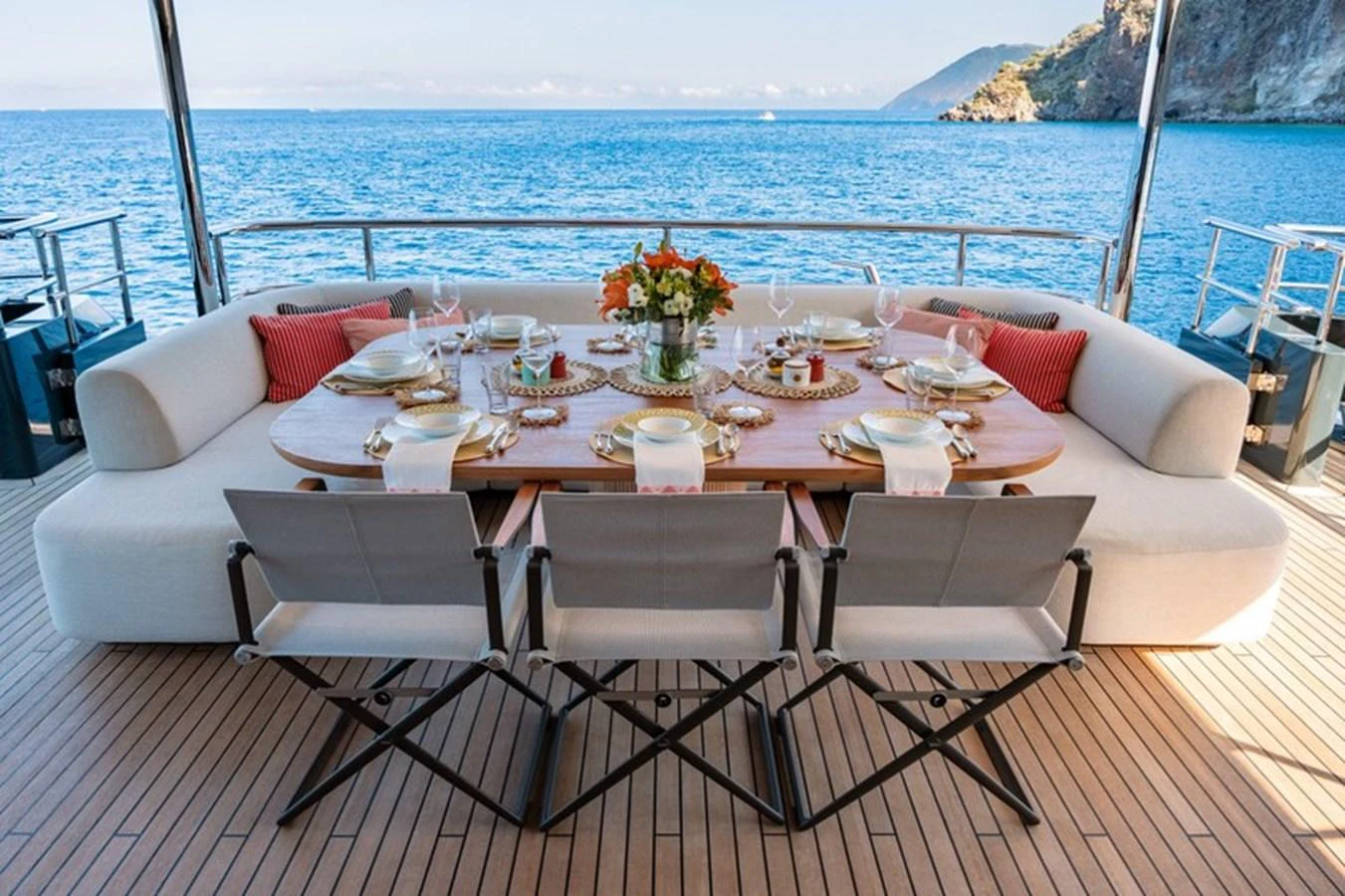 a table set for a meal on a boat aboard COCOON Yacht for Sale
