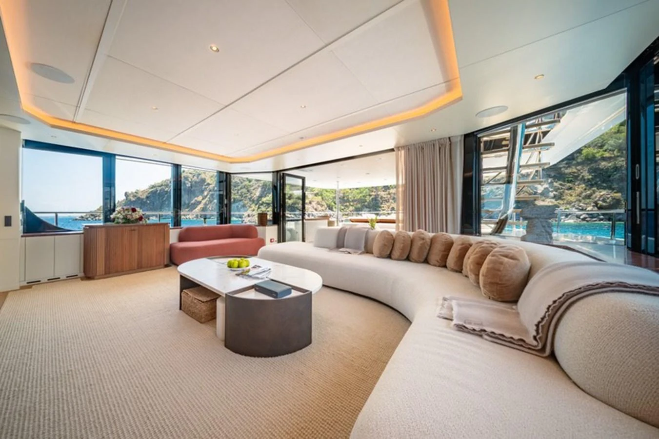 a living room with a large window aboard COCOON Yacht for Sale