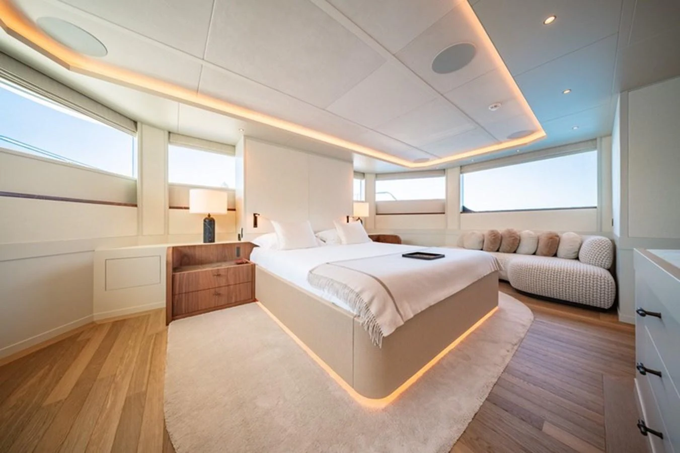 a large bedroom with a large bed aboard COCOON Yacht for Sale