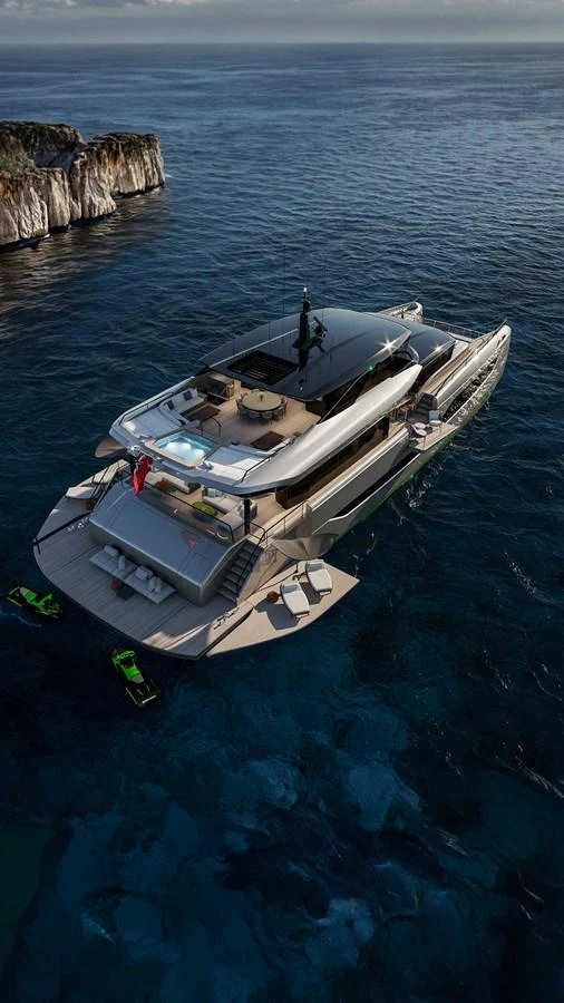 A luxurious yacht anchored in a serene coastal area with clear blue waters and a rocky shoreline. aboard ULTIMA 111 Yacht for Sale