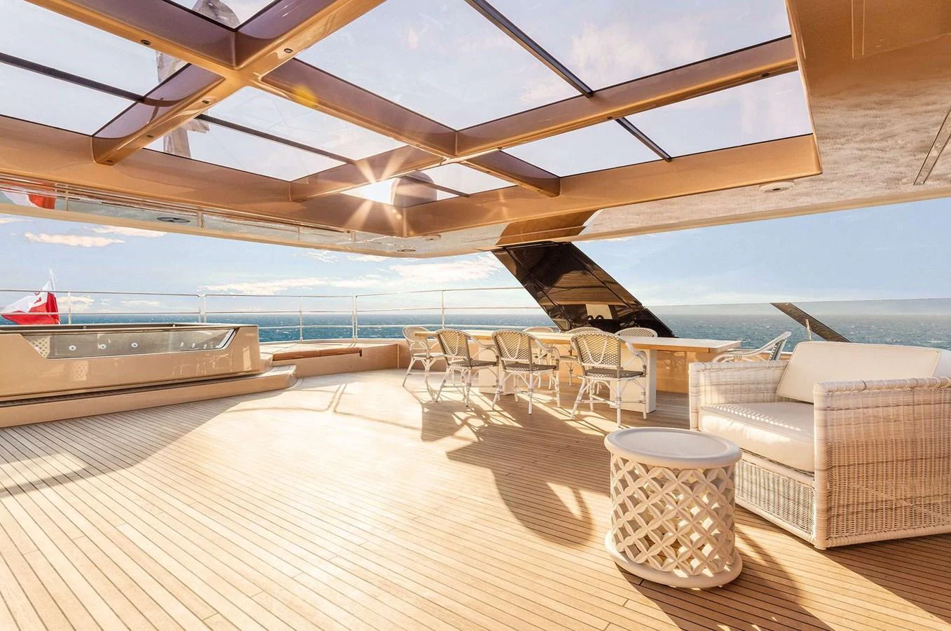 The sundeck offers a luxurious space with ample seating and a jacuzzi, perfect for relaxation and enjoying the ocean views. aboard 100 SUNREEF POWER NEXT Yacht for Sale