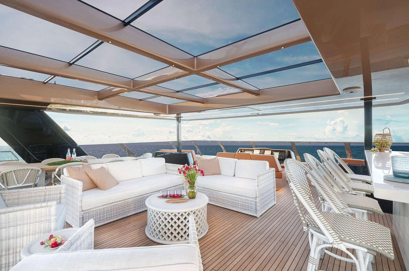 The sundeck offers a luxurious open-air lounge area with comfortable seating and stunning ocean views. aboard 100 SUNREEF POWER NEXT Yacht for Sale
