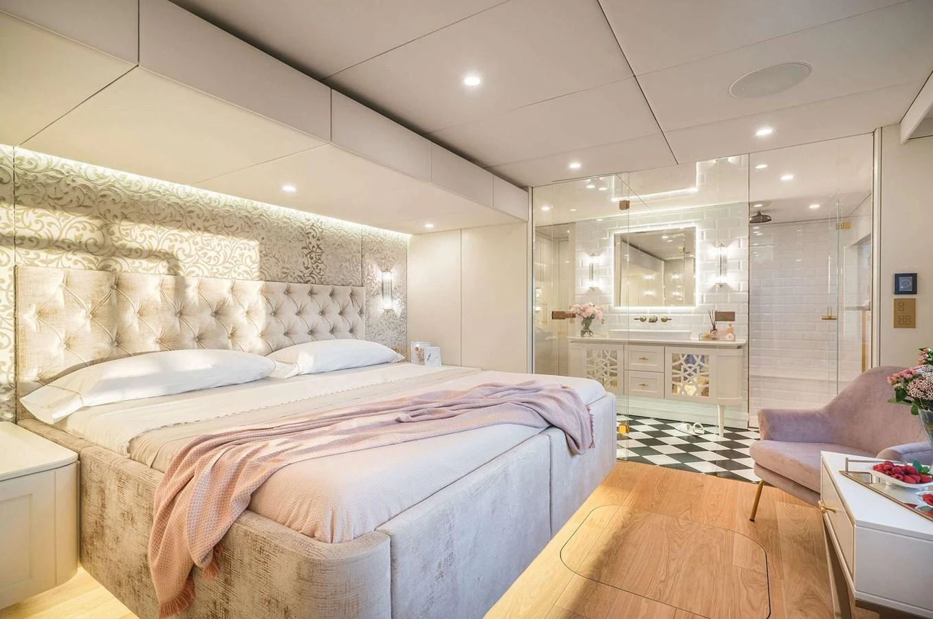 The master stateroom features a luxurious bed with elegant decor and an en-suite bathroom. aboard 100 SUNREEF POWER NEXT Yacht for Sale
