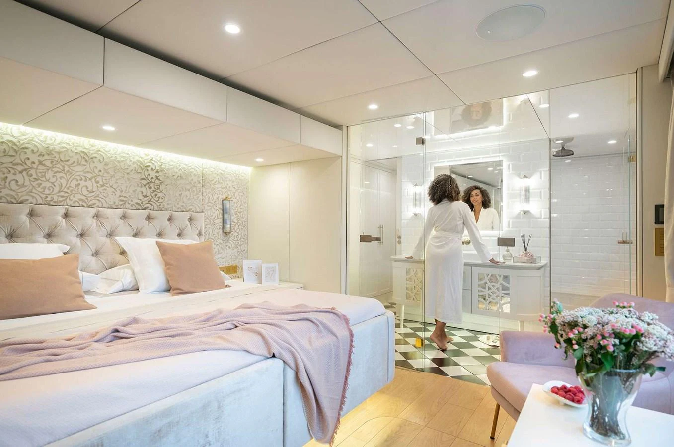 The master stateroom features a luxurious bed, elegant decor, and an en-suite bathroom with modern fixtures. aboard 100 SUNREEF POWER NEXT Yacht for Sale