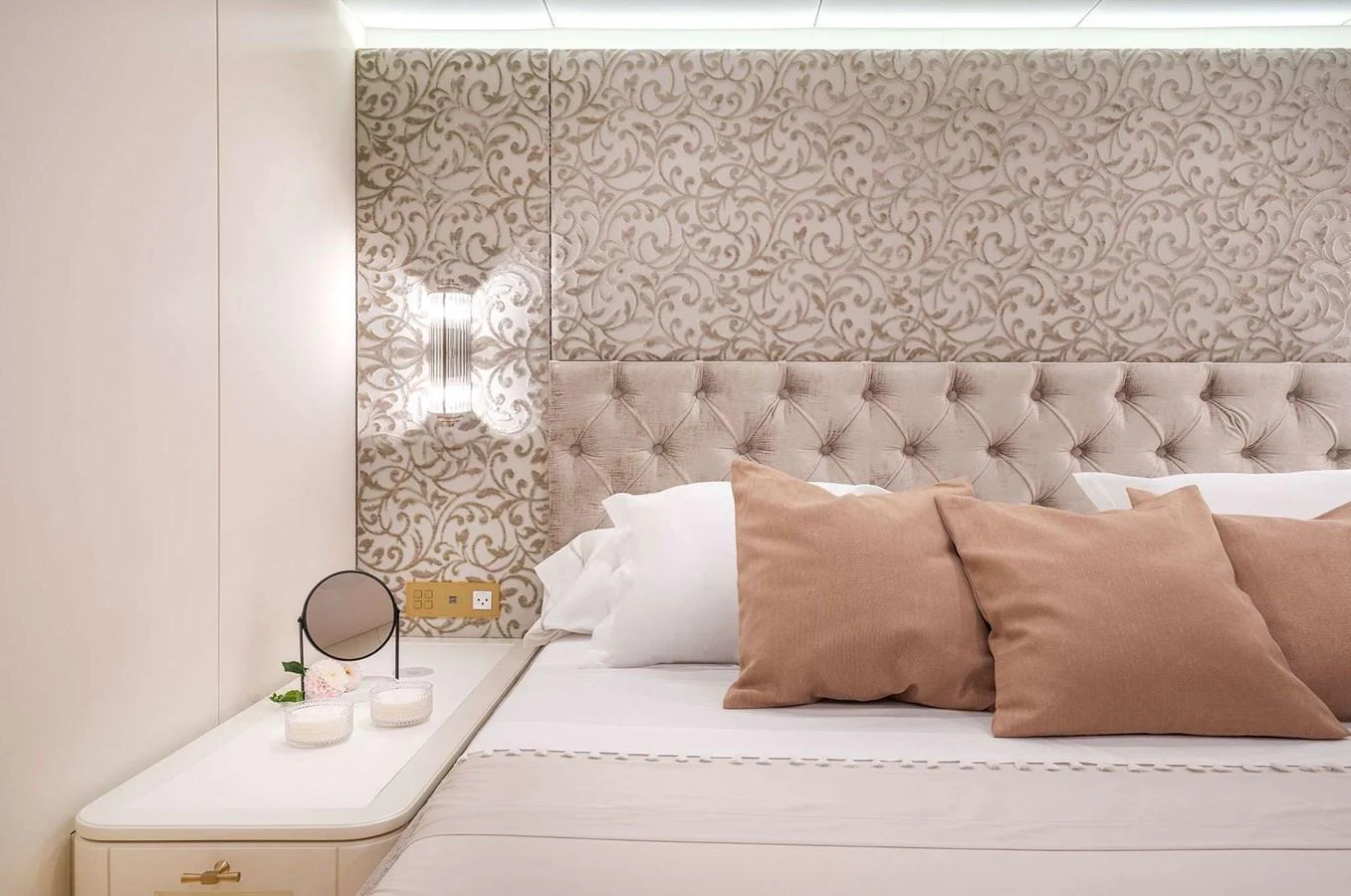 The stateroom features a plush bed with elegant decor and soft lighting. aboard 100 SUNREEF POWER NEXT Yacht for Sale