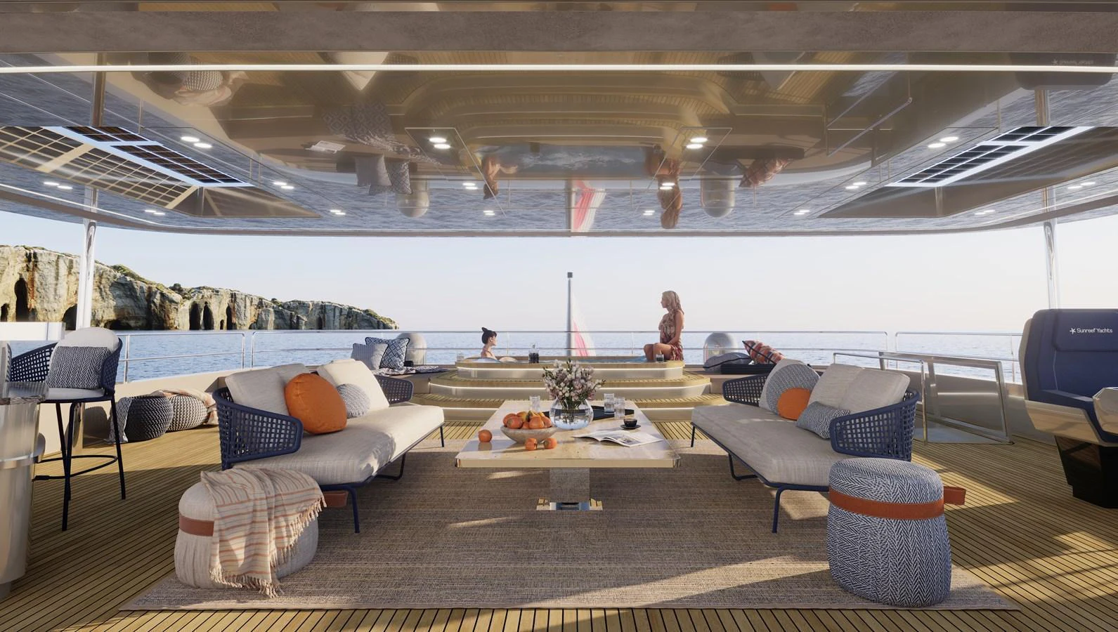 The aft deck features a spacious and luxurious lounging area with comfortable seating and stunning ocean views. aboard SUNREEF 100 NEXT Yacht for Sale