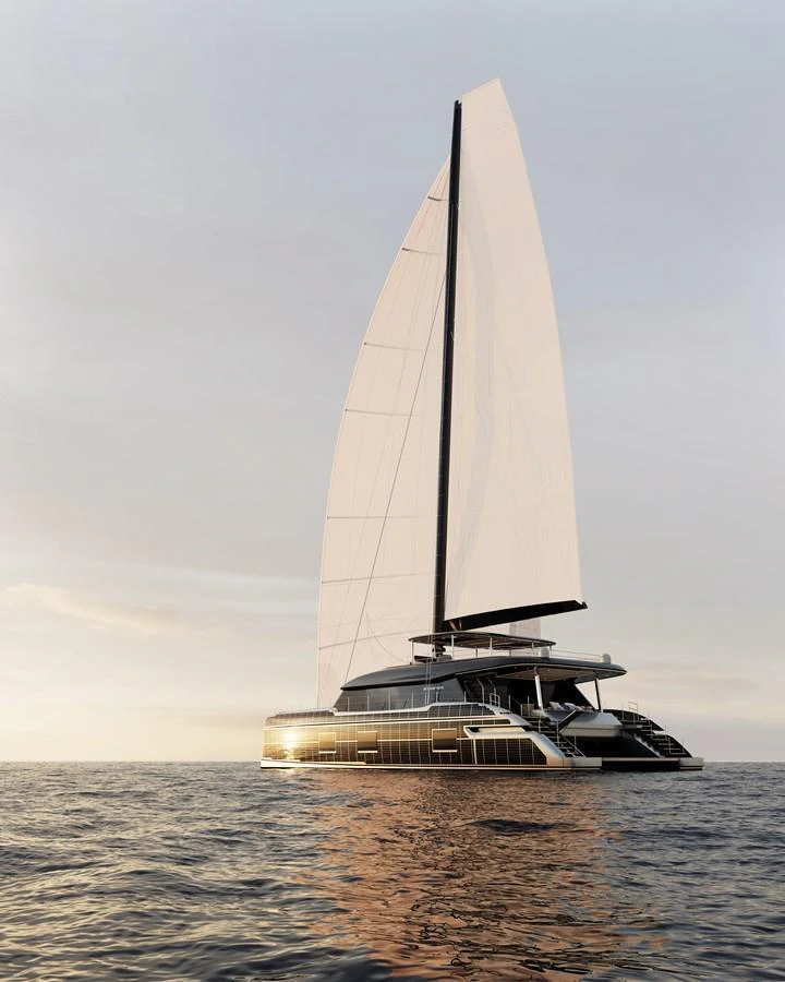 A sleek, modern sailing yacht glides gracefully on calm waters at sunset. aboard SUNREEF 100 NEXT Yacht for Sale