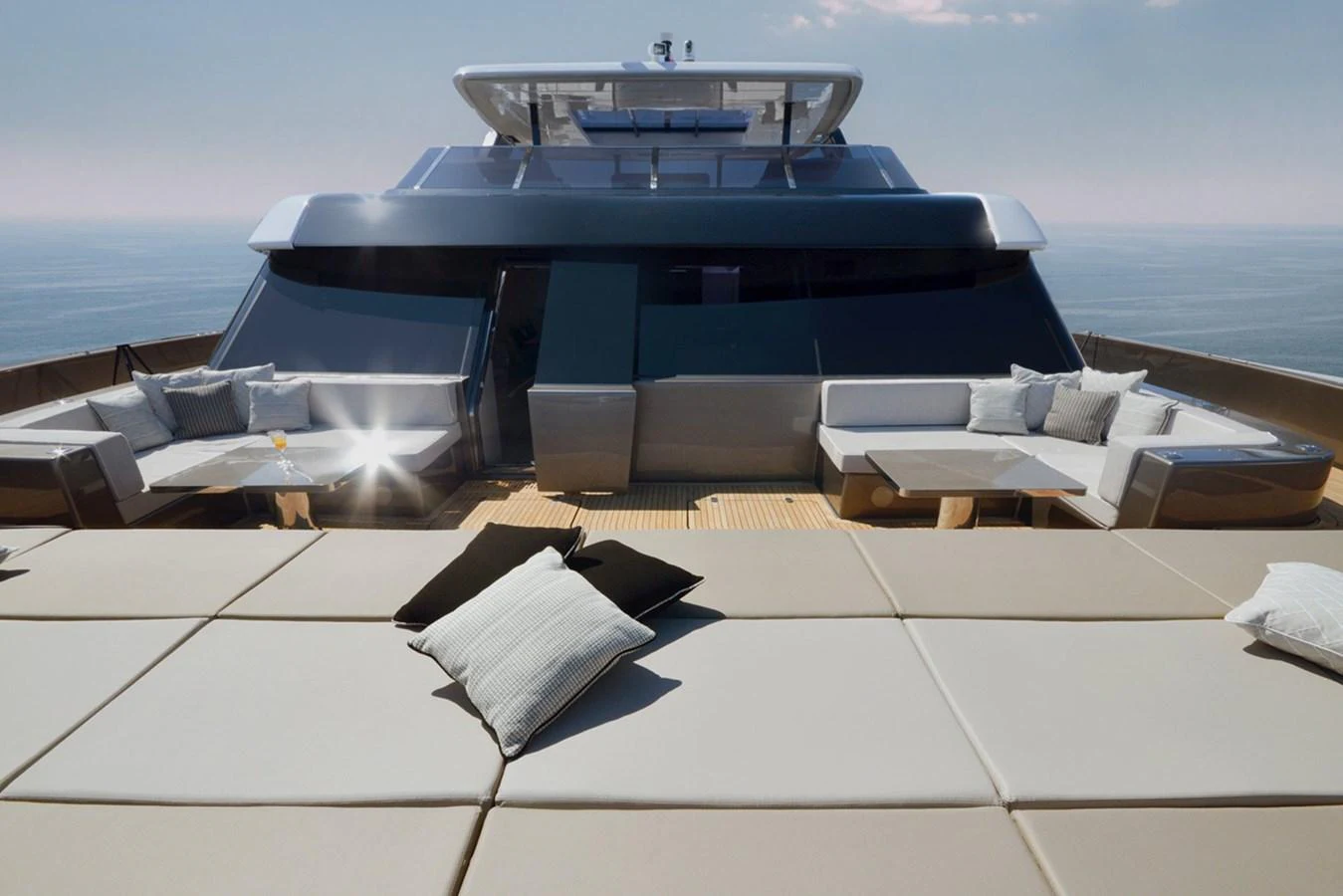 The yacht's sundeck offers luxurious lounging with plush seating and panoramic ocean views. aboard 80 SUNREEF POWER NEXT Yacht for Sale