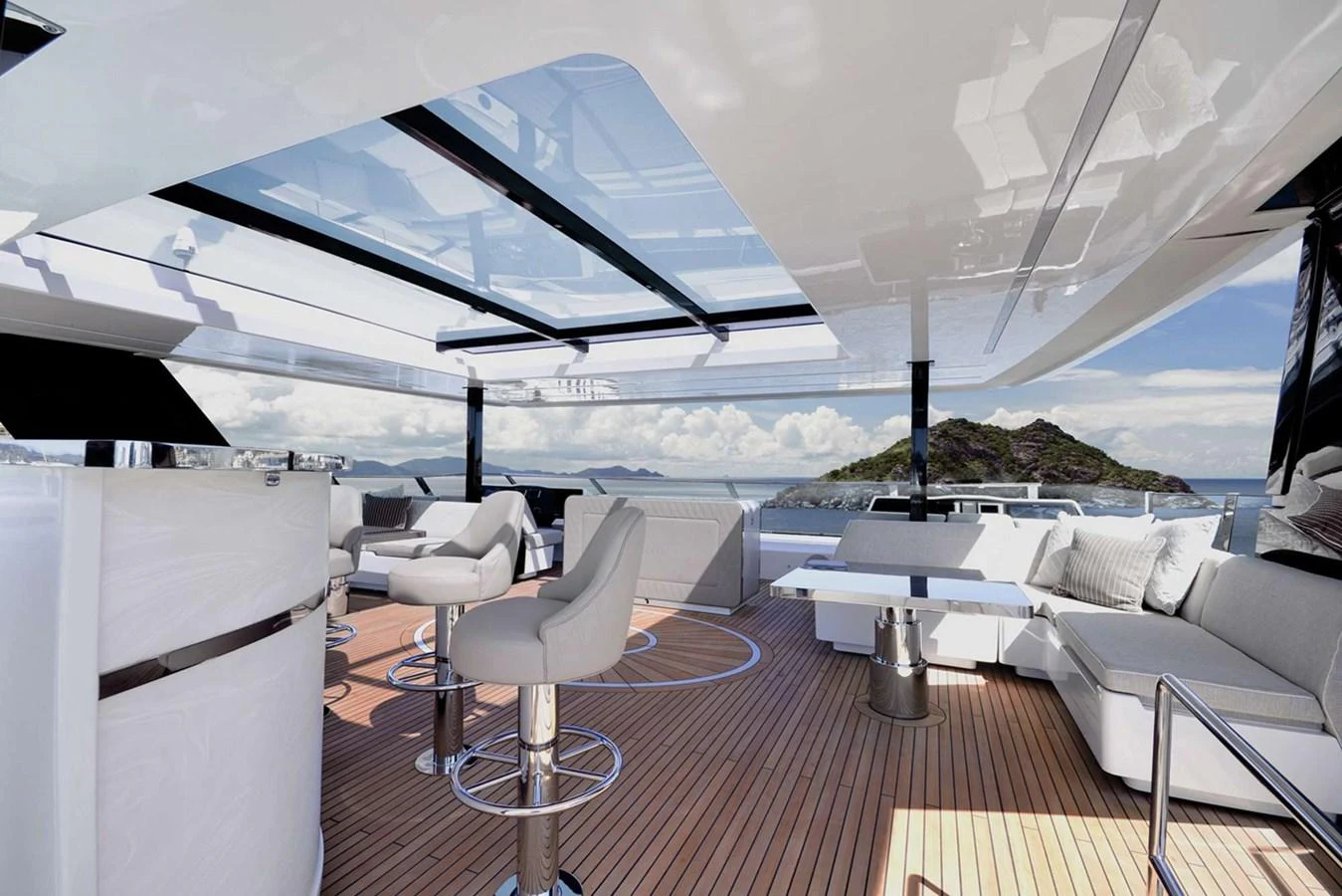 The sundeck offers a luxurious open-air space with comfortable seating and stunning views. aboard 80 SUNREEF POWER NEXT Yacht for Sale