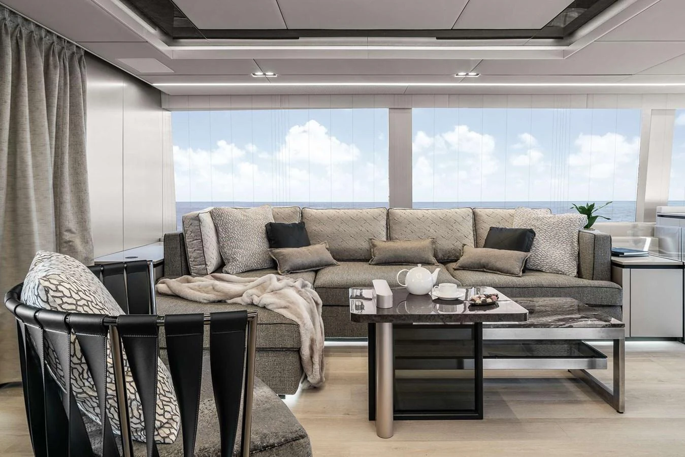 The salon features a spacious and elegant seating area with large windows offering stunning ocean views. aboard 80 SUNREEF POWER NEXT Yacht for Sale