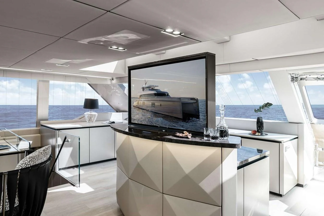 The salon features modern decor with a large TV and panoramic windows offering stunning ocean views. aboard 80 SUNREEF POWER NEXT Yacht for Sale