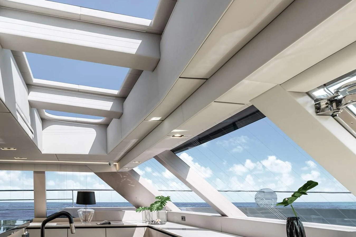 The yacht's salon features expansive windows and a sleek, modern design with ample natural light. aboard 80 SUNREEF POWER NEXT Yacht for Sale