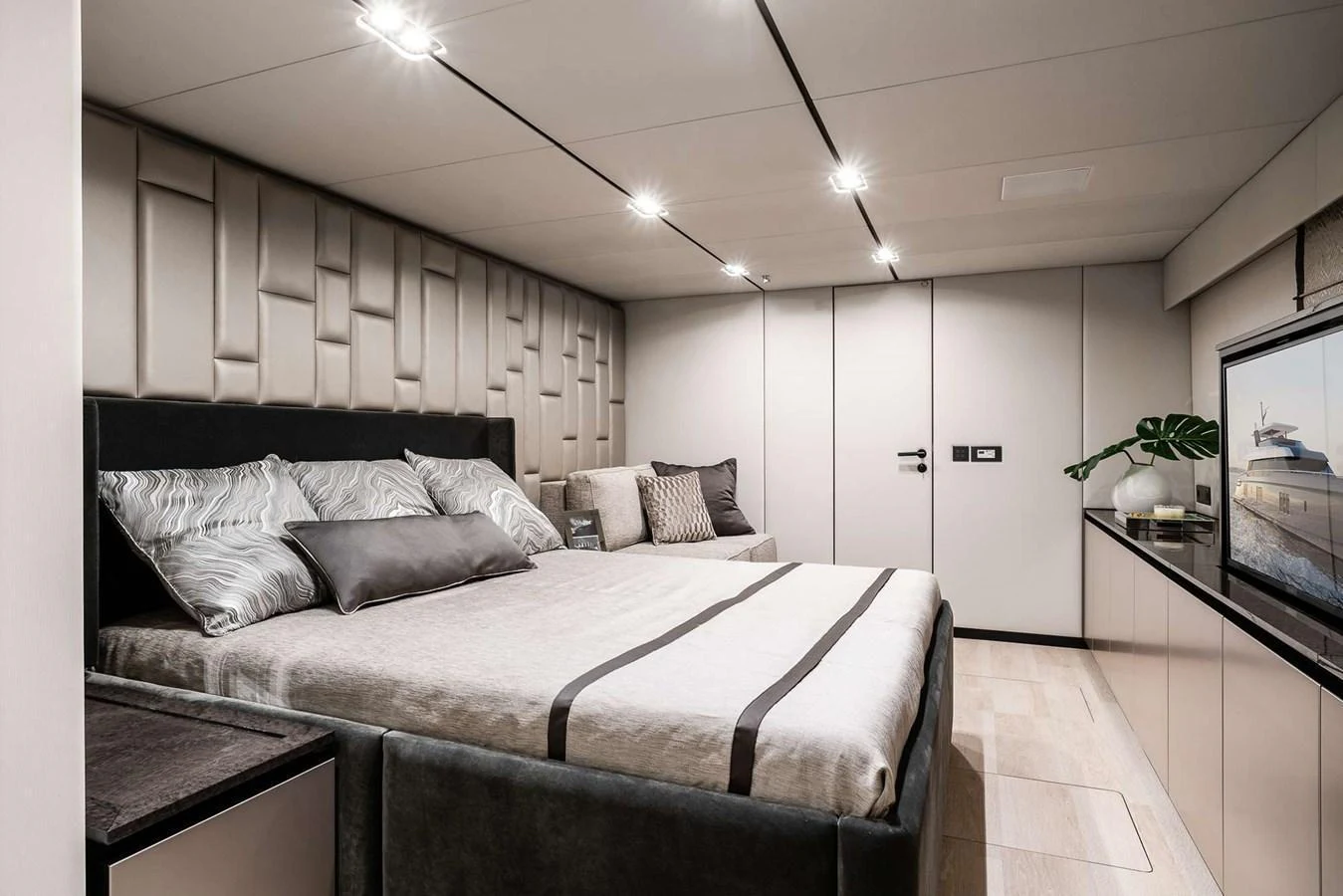 A luxurious stateroom featuring a plush bed and modern decor. aboard 80 SUNREEF POWER NEXT Yacht for Sale