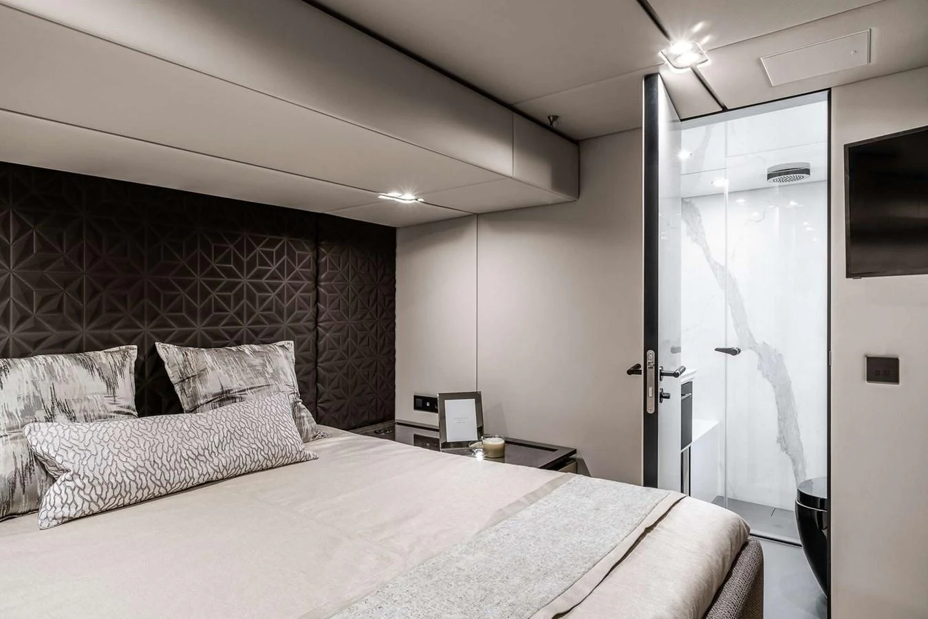 The stateroom features a luxurious bed with modern decor and an ensuite bathroom. aboard 80 SUNREEF POWER NEXT Yacht for Sale