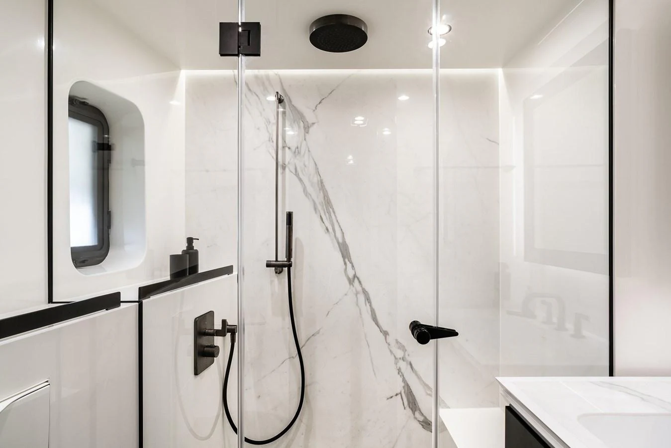 The yacht's bathroom features a sleek, modern design with marble accents and high-end fixtures. aboard 80 SUNREEF POWER NEXT Yacht for Sale