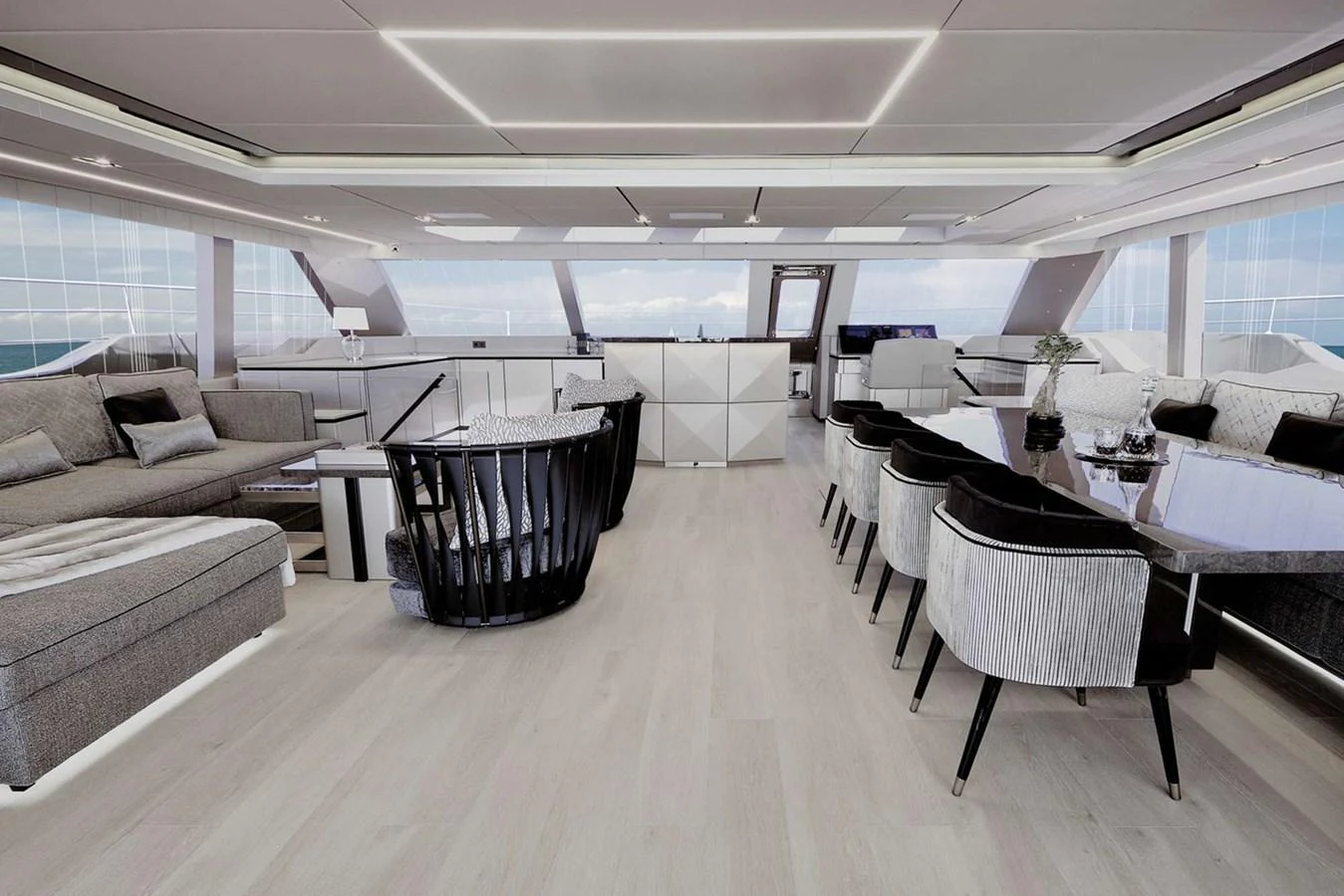 The yacht's salon features a spacious and modern design with ample seating and a dining area. aboard 80 SUNREEF POWER NEXT Yacht for Sale