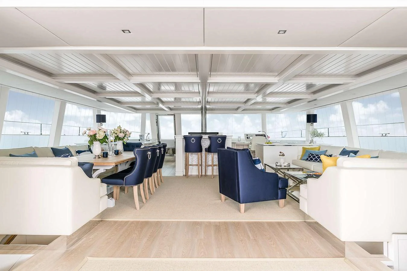 The spacious salon features elegant seating arrangements and large windows for panoramic views. aboard SUNREEF 80 NEXT Yacht for Sale