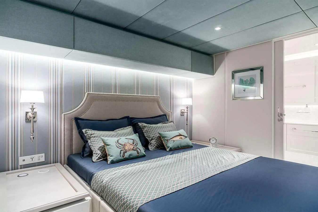 A luxurious stateroom featuring a plush bed with elegant bedding and soft lighting. aboard SUNREEF 80 NEXT Yacht for Sale