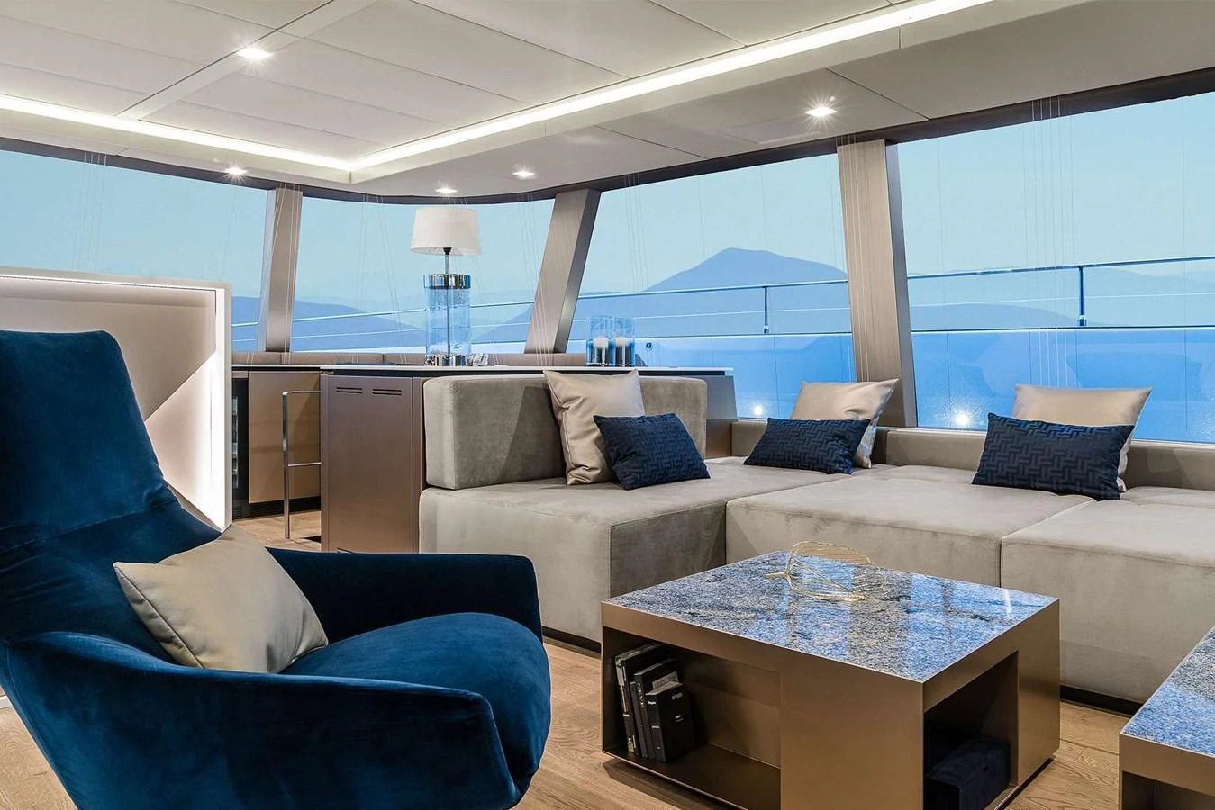 The yacht's salon features luxurious seating with panoramic views through large windows. aboard SUNREEF 80 NEXT Yacht for Sale